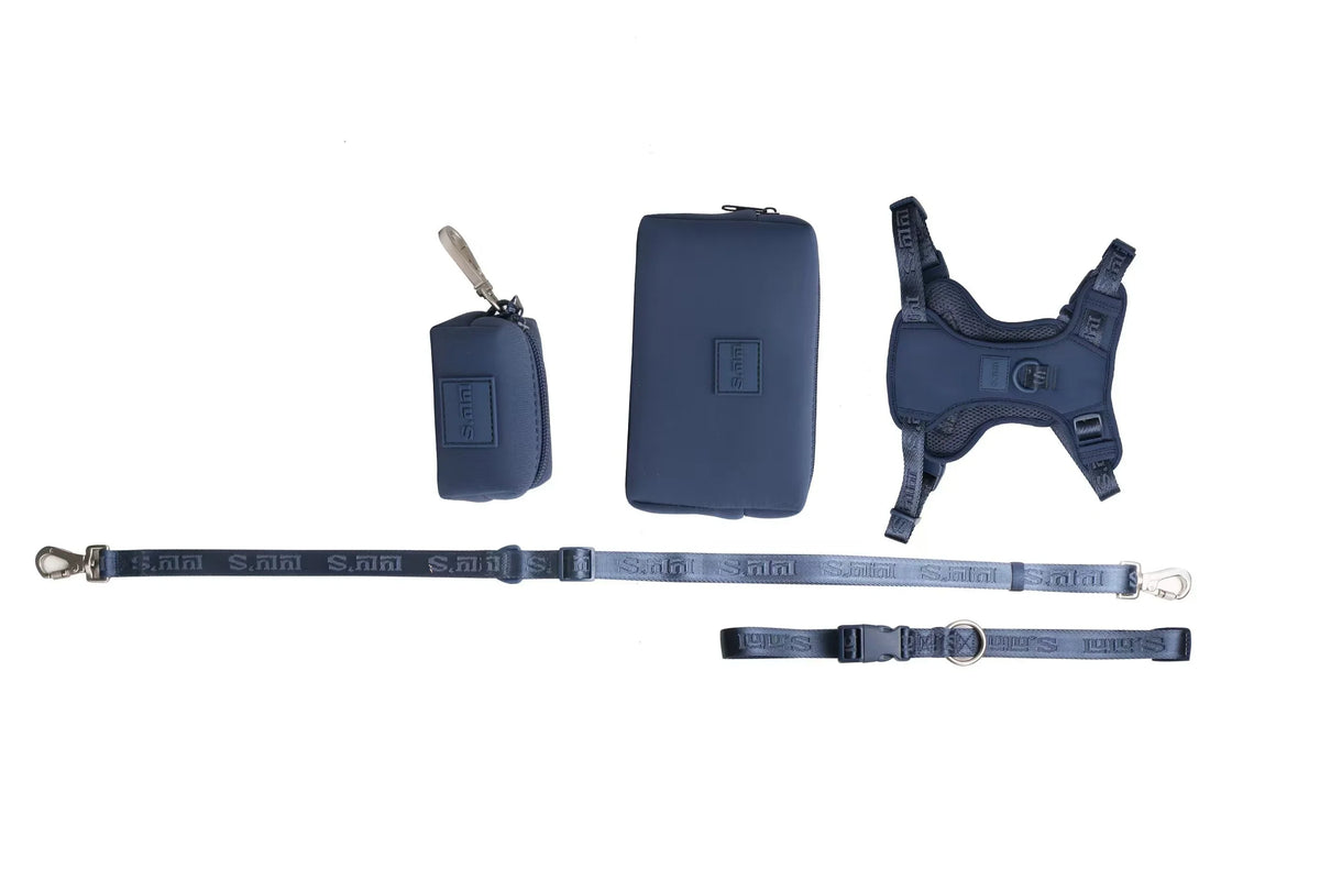 Blueberry Blue Lulu's from Cali walking set laid flat: harness, horizontal pouch, waste bag holder, leash and belt