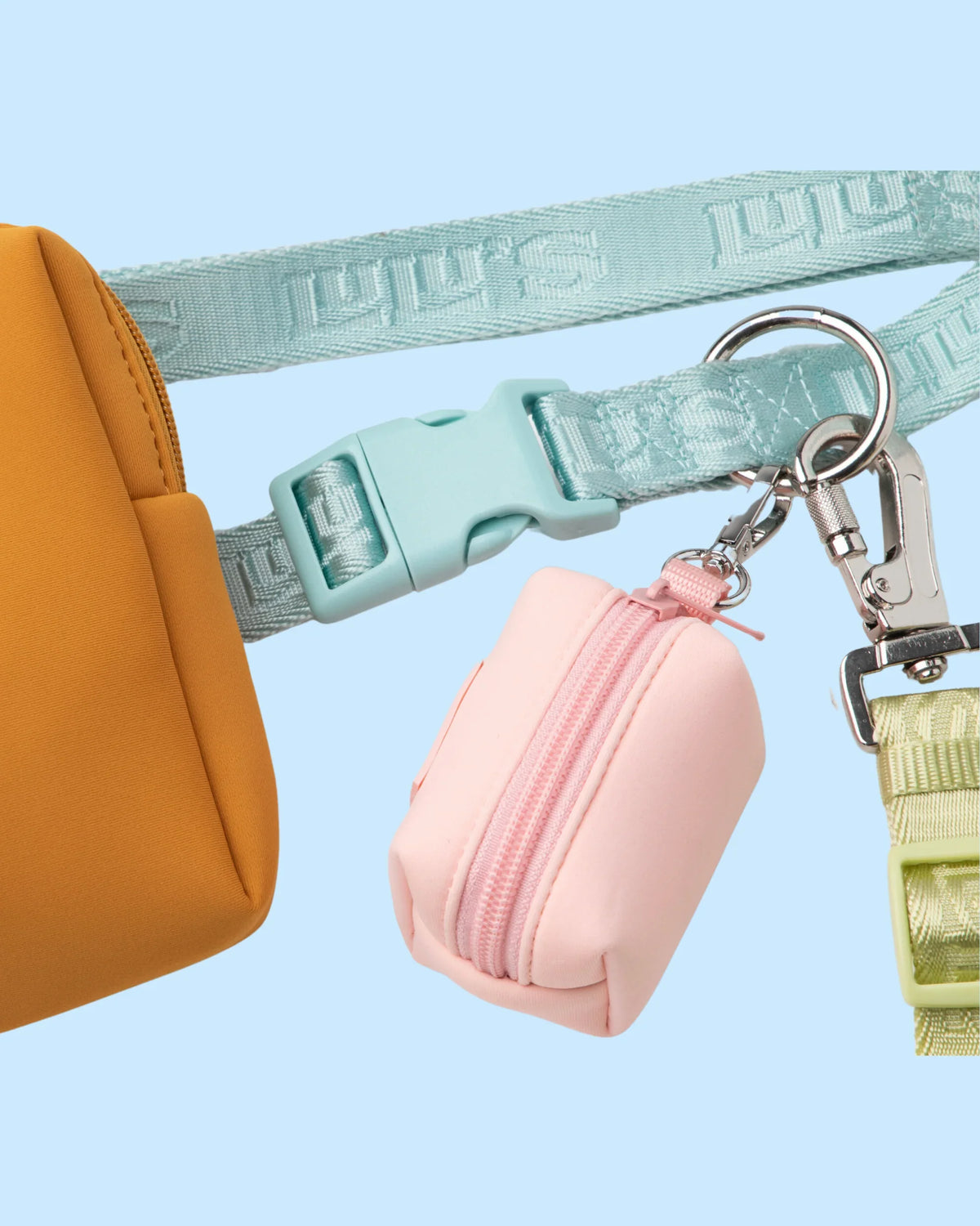 Close-up of Lulu's from Cali leash, belt, pouch and waste bag holder in Cali Blue, Sand Orange, Blush Pink and Matcha Green