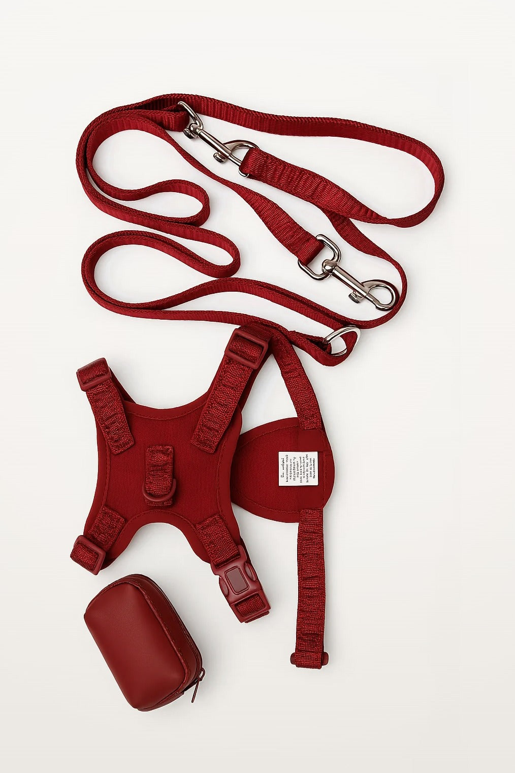 Cherry Red Lulu's from Cali leash, harness and waste bag holder laid flat