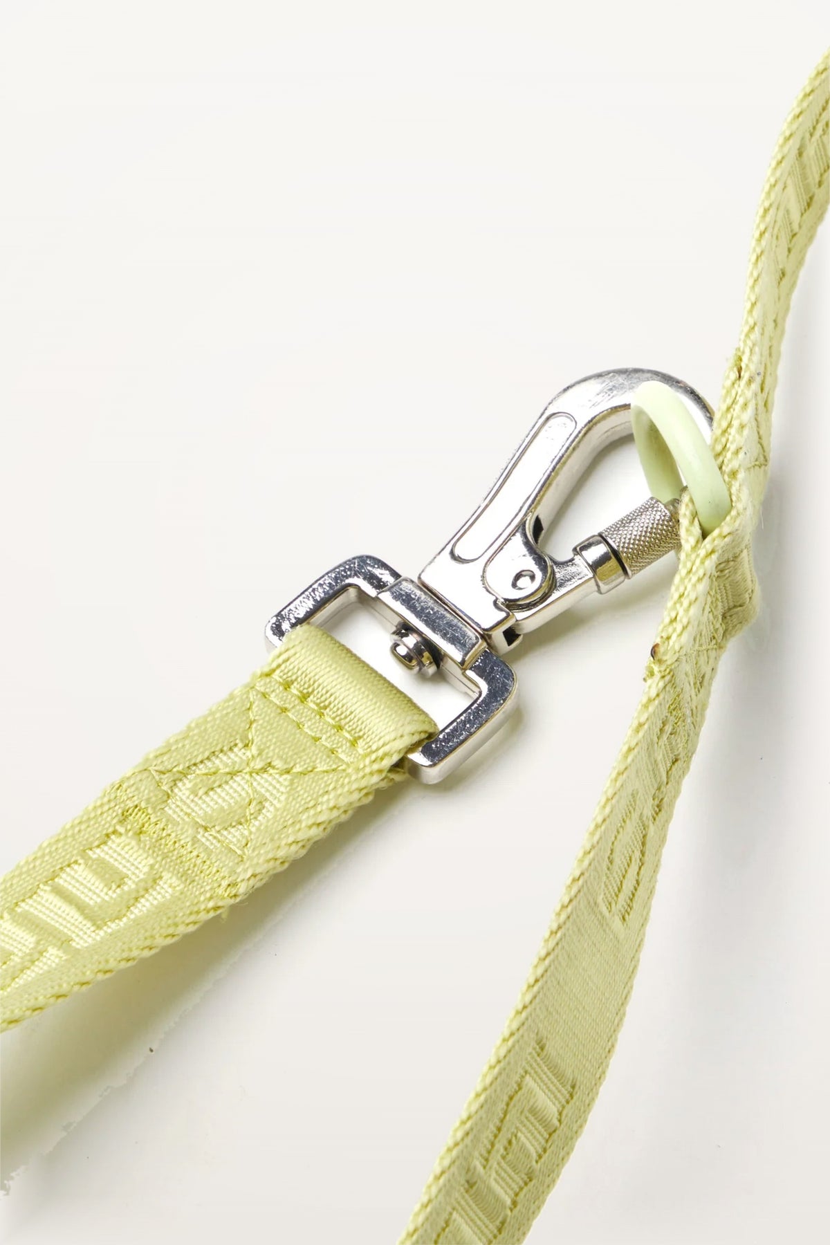 Close-up of Lulu’s from Cali Matcha Green dog leash featuring the silver metal clip and signature woven logo detail.