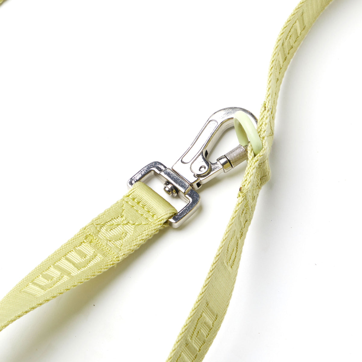 Close-up of Lulu’s from Cali Matcha Green dog leash featuring the silver metal clip and signature woven logo detail.