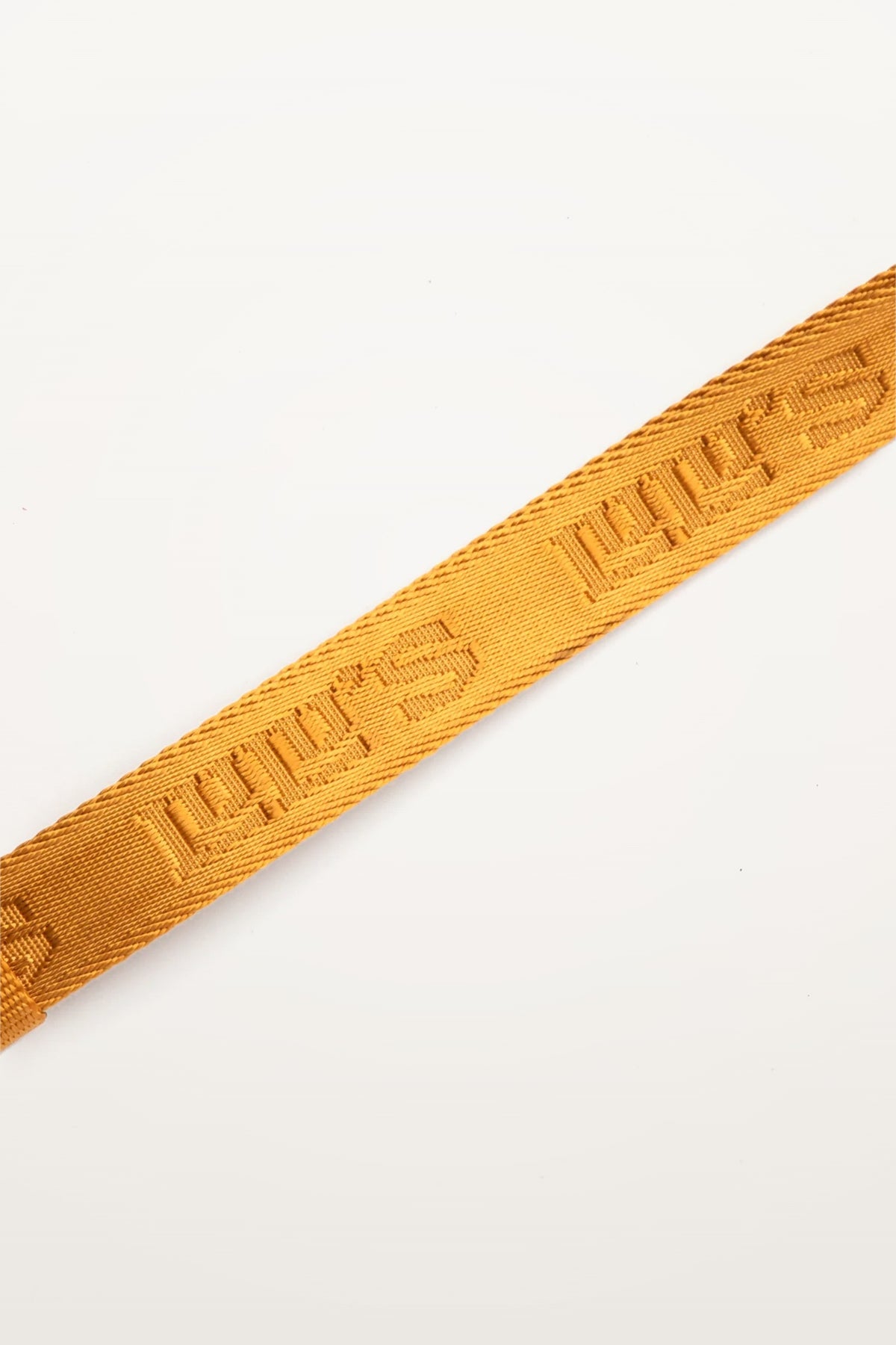 Close-up of Lulu’s from Cali Sand Orange dog leash featuring the signature woven logo detail.