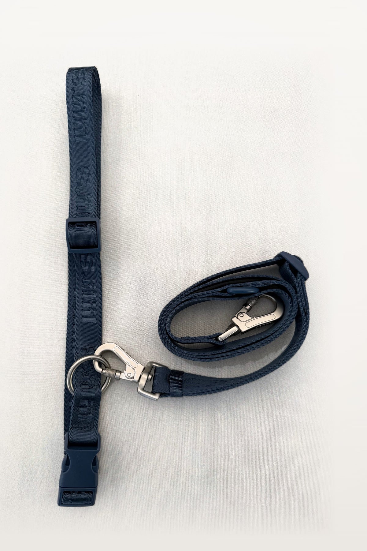 Blueberry Blue Lulu's from Cali leash with silver clips, laid flat