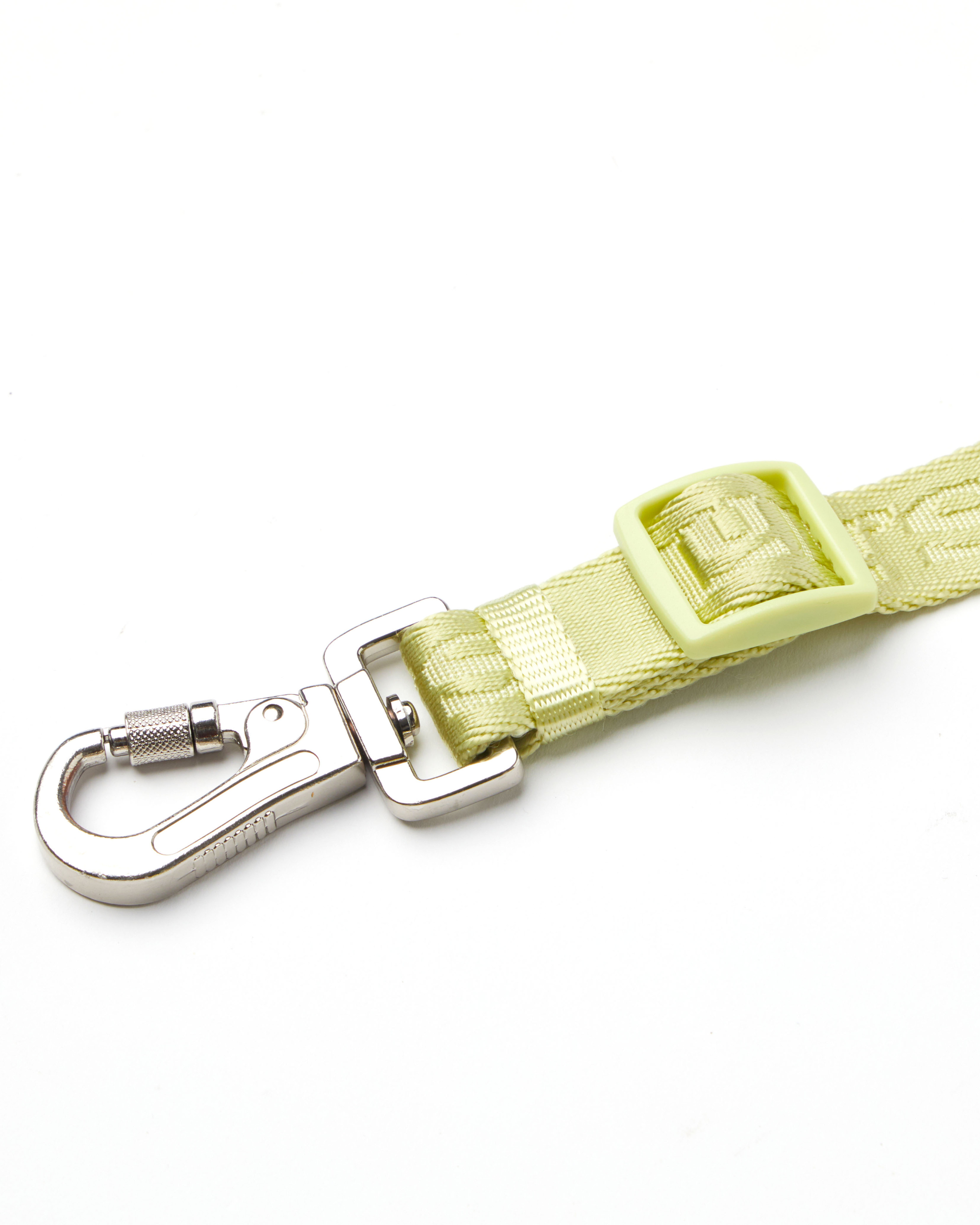 A close-up view of a Matcha Green Lulu's dog leash with a metal clip and adjustable buckle, showcasing the durable and secure attachment design