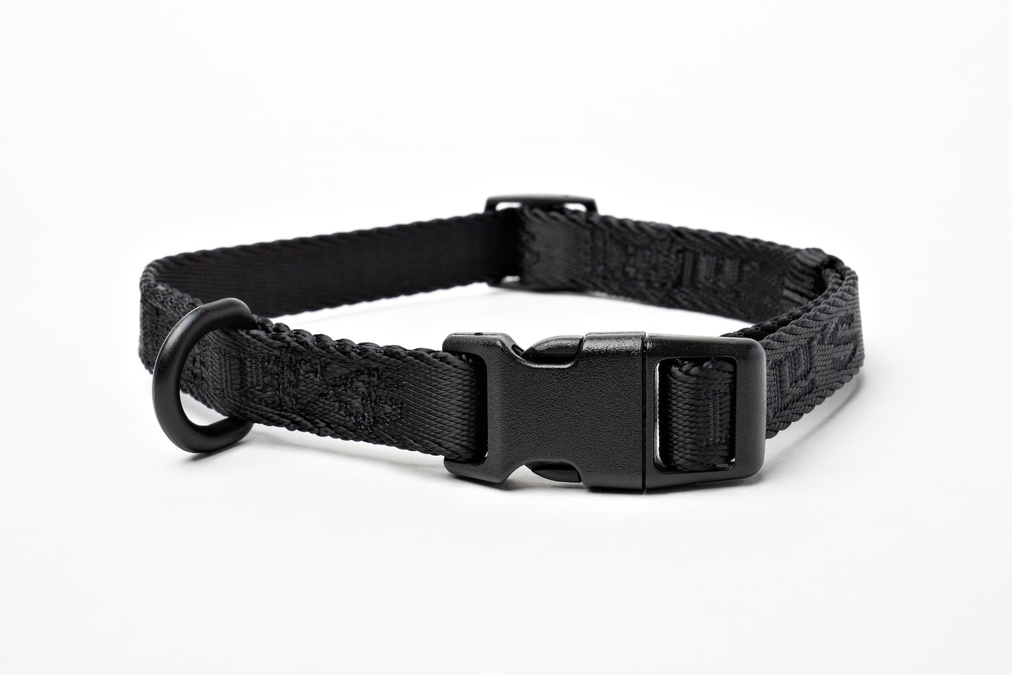 Close-up of Lulu's Midnight Black adjustable collar, showcasing its durable construction, secure buckle, and sleek design